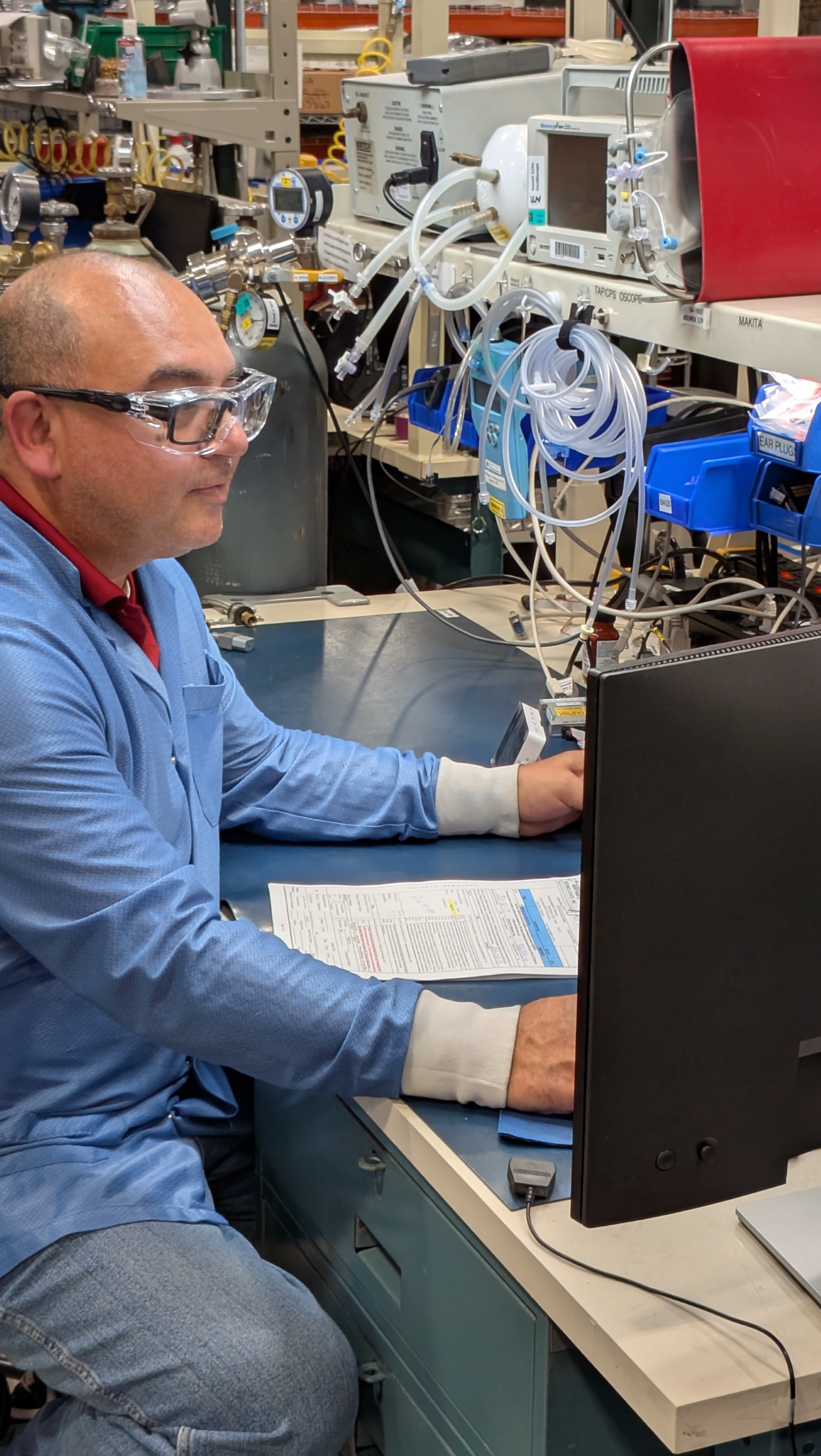 Person in lab working on computer
