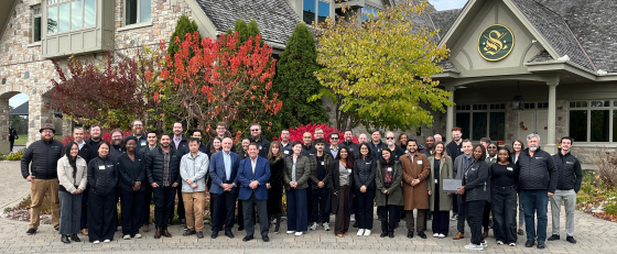 Group of Trudell employees outside of a building